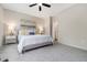 Neutral bedroom boasts a queen bed, carpet, and ensuite bathroom at 1544 Burberry Aly, Marietta, GA 30008