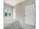 Lovely bedroom boasts a balcony, white paneled doors, neutral walls and floors at 1548 Burberry Aly, Marietta, GA 30008