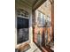 Inviting front door with sidelight windows and charming architectural details with brick stairs and wrought iron at 2823 Mount Wilkinson Se Pkwy # 14, Atlanta, GA 30339