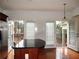 Eat-in kitchen featuring stainless steel refrigerator, dark island and access to outside deck at 2823 Mount Wilkinson Se Pkwy # 14, Atlanta, GA 30339