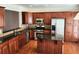 Updated kitchen boasts cherry cabinets, stainless steel appliances, granite countertops and hardwood floors at 2823 Mount Wilkinson Se Pkwy # 14, Atlanta, GA 30339