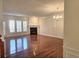 Large, light-filled living room features a cozy fireplace and elegant chandelier at 2823 Mount Wilkinson Se Pkwy # 14, Atlanta, GA 30339