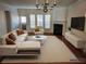 Bright, staged living room with fireplace, modern furniture, and hardwood floors at 2823 Mount Wilkinson Se Pkwy # 14, Atlanta, GA 30339