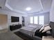 Comfortable main bedroom with tray ceiling, plush carpet, and ample natural light at 2823 Mount Wilkinson Se Pkwy # 14, Atlanta, GA 30339