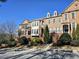 Brick townhomes offer elegance and style, complemented by manicured landscaping and inviting curb appeal at 2823 Mount Wilkinson Se Pkwy # 14, Atlanta, GA 30339