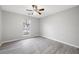 Empty bedroom with grey wood-look floors and a ceiling fan at 3976 Sharon Spgs, Powder Springs, GA 30127