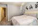 Bedroom featuring neutral walls and a view of the upstairs hallway at 5008 Whiteoak Pointe Se # 15, Smyrna, GA 30080