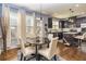 Bright dining area with hardwood floors, modern lighting, and access to the kitchen at 5008 Whiteoak Pointe Se # 15, Smyrna, GA 30080