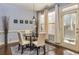 Charming dining area with hardwood floors, natural light, and a view of the backyard at 5008 Whiteoak Pointe Se # 15, Smyrna, GA 30080