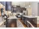 Modern kitchen with dark cabinetry, stainless steel appliances, and quartz countertops at 5008 Whiteoak Pointe Se # 15, Smyrna, GA 30080