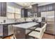 Modern kitchen with stainless steel appliances, white countertops, and an island with seating at 5008 Whiteoak Pointe Se # 15, Smyrna, GA 30080