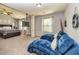 Spacious main bedroom features high ceilings, a king bed, column, and a TV at 5008 Whiteoak Pointe Se # 15, Smyrna, GA 30080