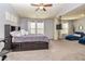 Spacious main bedroom with a queen sized bed, carpet flooring, and two windows at 5008 Whiteoak Pointe Se # 15, Smyrna, GA 30080