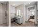 Well-lit bathroom featuring a glass-enclosed shower, vanity area, and access to a bedroom at 750 Park Ne Ave # 25W, Atlanta, GA 30326