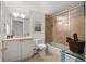 Bathroom featuring a vanity, toilet, and shower tub with sliding glass doors at 750 Park Ne Ave # 25W, Atlanta, GA 30326