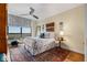 Comfortable bedroom featuring a large window, stylish bedding, and tasteful decor at 750 Park Ne Ave # 25W, Atlanta, GA 30326