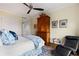 Cozy bedroom featuring hardwood floors, stylish bedding, and a chair, creating a relaxing retreat at 750 Park Ne Ave # 25W, Atlanta, GA 30326