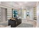 Elegant entryway featuring striped walls, a mirrored wall, dark console table, and artwork at 750 Park Ne Ave # 25W, Atlanta, GA 30326