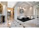 Long hallway with marble floors, recessed lighting, and refined decor leading to a comfortable lounge area at 750 Park Ne Ave # 25W, Atlanta, GA 30326