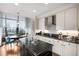 Elegant kitchen with white cabinets, granite countertops, and a breakfast nook at 750 Park Ne Ave # 25W, Atlanta, GA 30326