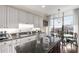 Bright kitchen with granite countertops, double sink, and an eat-in breakfast nook at 750 Park Ne Ave # 25W, Atlanta, GA 30326