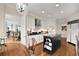 Elegant kitchen featuring an island, stainless steel appliances, and hardwood floors at 750 Park Ne Ave # 25W, Atlanta, GA 30326