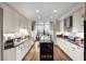 Modern kitchen with a central island, granite countertops, and stainless steel appliances at 750 Park Ne Ave # 25W, Atlanta, GA 30326