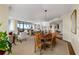 Open living space with dining area, large windows, and elegant decor at 750 Park Ne Ave # 25W, Atlanta, GA 30326