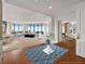 Expansive living room with elegant furnishings, large windows, and views of the city at 750 Park Ne Ave # 25W, Atlanta, GA 30326