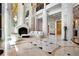 Elegant lobby featuring soaring ceilings, marble floors, and a cozy seating area with a fireplace at 750 Park Ne Ave # 25W, Atlanta, GA 30326