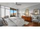 Bright main bedroom with a balcony, hardwood floors, and natural light at 750 Park Ne Ave # 25W, Atlanta, GA 30326