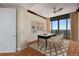 Home office featuring a large window, desk, hardwood floors, and neutral decor at 750 Park Ne Ave # 25W, Atlanta, GA 30326