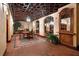 Charming wine cellar showcasing custom storage, brick floors, and a cozy seating area for wine tasting at 750 Park Ne Ave # 25W, Atlanta, GA 30326