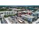 An aerial shot of modern buildings, retail spaces, and parking areas near a picturesque lake at 1100 Howell Mill Nw Rd # 708, Atlanta, GA 30318