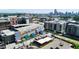 An aerial view highlighting new apartment buildings, commercial spaces, and parking areas at 1100 Howell Mill Nw Rd # 708, Atlanta, GA 30318