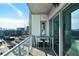 Balcony with a bar table and seating with views of the city skyline at 1100 Howell Mill Nw Rd # 708, Atlanta, GA 30318