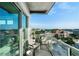 Condo balcony with glass railings provides clear views of the surrounding city at 1100 Howell Mill Nw Rd # 708, Atlanta, GA 30318