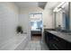 Modern bathroom featuring a soaking tub, sleek vanity, and neutral color palette at 1100 Howell Mill Nw Rd # 708, Atlanta, GA 30318