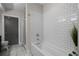 Bright bathroom featuring subway tile, a modern bathtub, and contemporary design at 1100 Howell Mill Nw Rd # 708, Atlanta, GA 30318