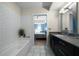 Bright bathroom showcasing tile floors, white subway tile in the shower, and a bedroom view at 1100 Howell Mill Nw Rd # 708, Atlanta, GA 30318