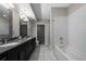 Elegant bathroom with double vanity, subway tile shower, and modern fixtures at 1100 Howell Mill Nw Rd # 708, Atlanta, GA 30318