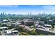 A cityscape featuring modern buildings, lush greenery, and a vibrant street with businesses and residences at 1100 Howell Mill Nw Rd # 708, Atlanta, GA 30318