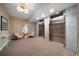 An elevator lobby with neutral tones, seating area, and stainless steel elevators at 1100 Howell Mill Nw Rd # 708, Atlanta, GA 30318