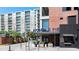 Street view of a restaurant with outdoor seating near modern apartments and ample parking at 1100 Howell Mill Nw Rd # 708, Atlanta, GA 30318