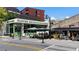 Flower restaurant exterior with outdoor seating and bright awnings on a sunny day at 1100 Howell Mill Nw Rd # 708, Atlanta, GA 30318