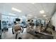 Well-equipped gym with various machines and large windows overlooking the pool at 1100 Howell Mill Nw Rd # 708, Atlanta, GA 30318
