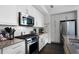 Modern kitchen featuring stainless steel appliances, white cabinets, and sleek countertops at 1100 Howell Mill Nw Rd # 708, Atlanta, GA 30318