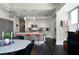 Open floor plan featuring a modern kitchen, dining area, and a gray accent wall at 1100 Howell Mill Nw Rd # 708, Atlanta, GA 30318