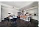 Modern kitchen features an island with seating, stainless appliances, and a dining area with dark hardwood floors at 1100 Howell Mill Nw Rd # 708, Atlanta, GA 30318