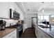 Modern kitchen with stainless steel appliances, dark wood floors, and white cabinetry at 1100 Howell Mill Nw Rd # 708, Atlanta, GA 30318